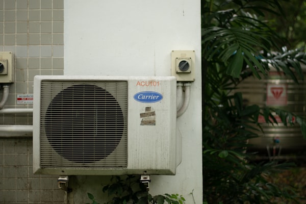 Outdoor AC condenser unit for home cooling